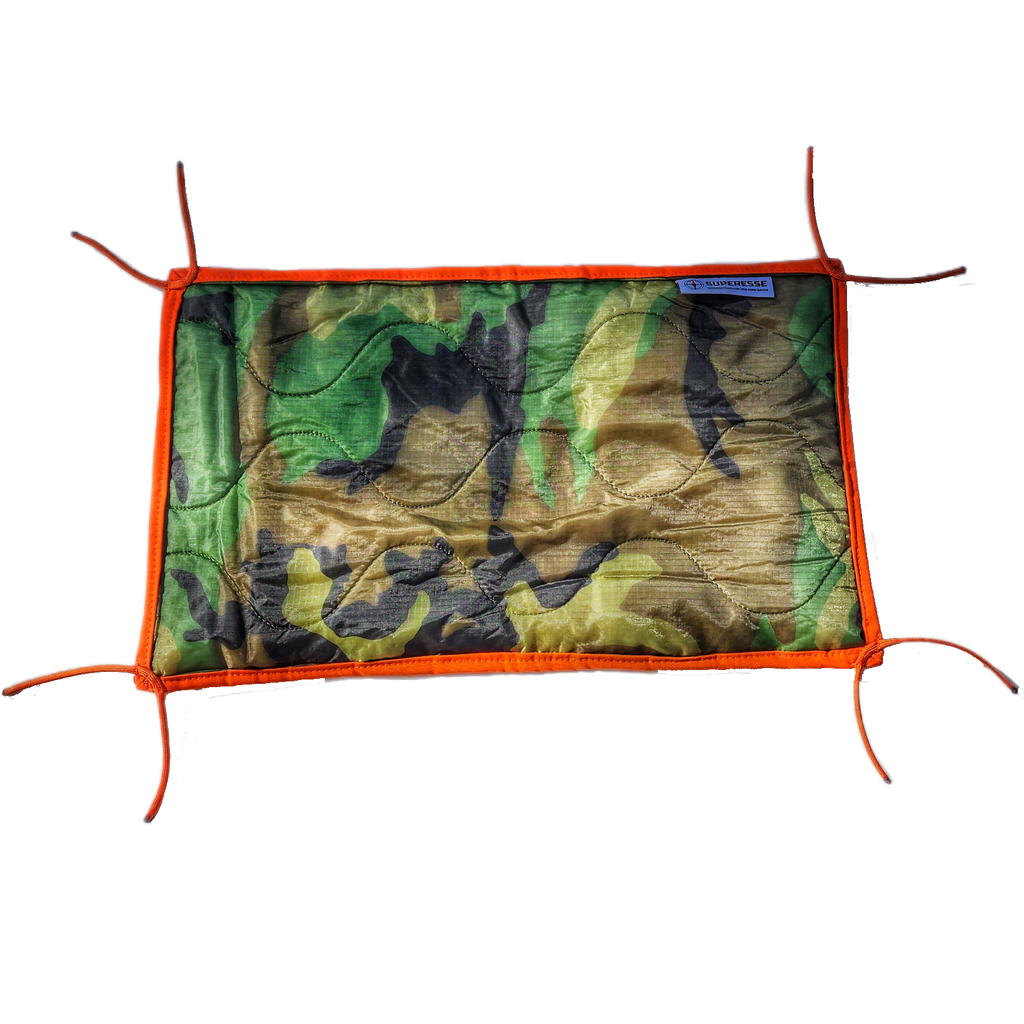 Woobie Hank: Insulated with USGI poncho-liner, serves as a large rag, knee pad, and adventure companion tool.
