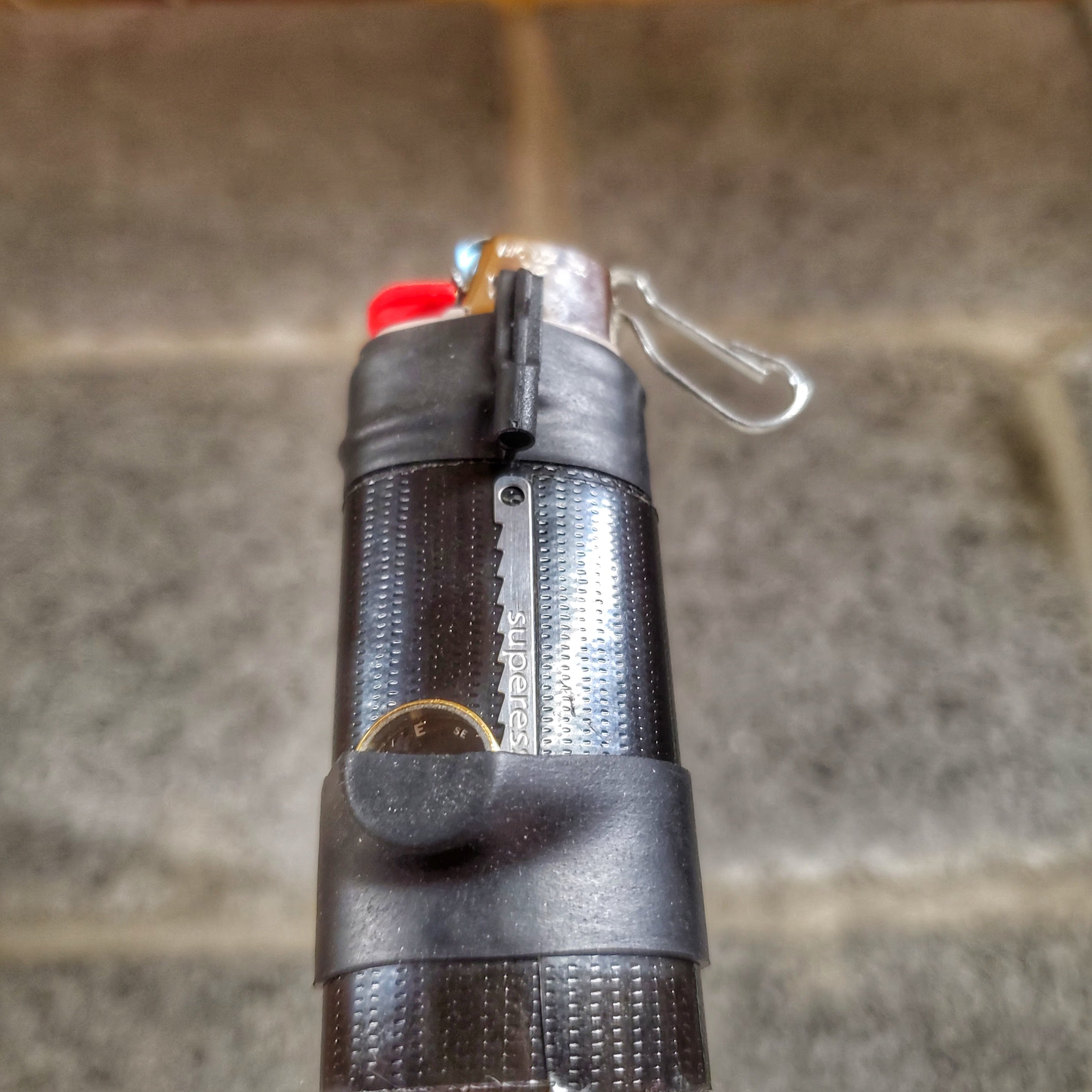 Survival Kit Lighter - Fire Starter outfitted with supplies.