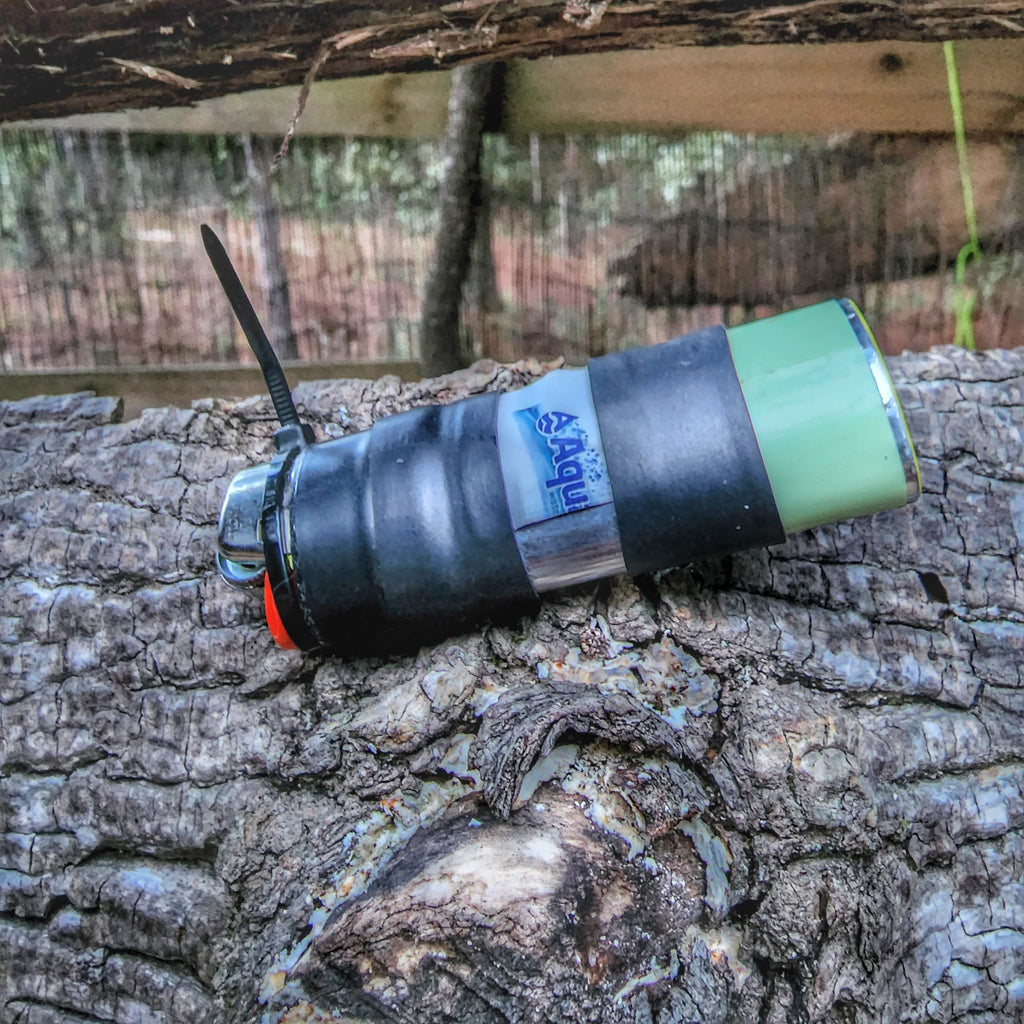Survival Kit Lighter - Fire Starter outfitted with supplies.