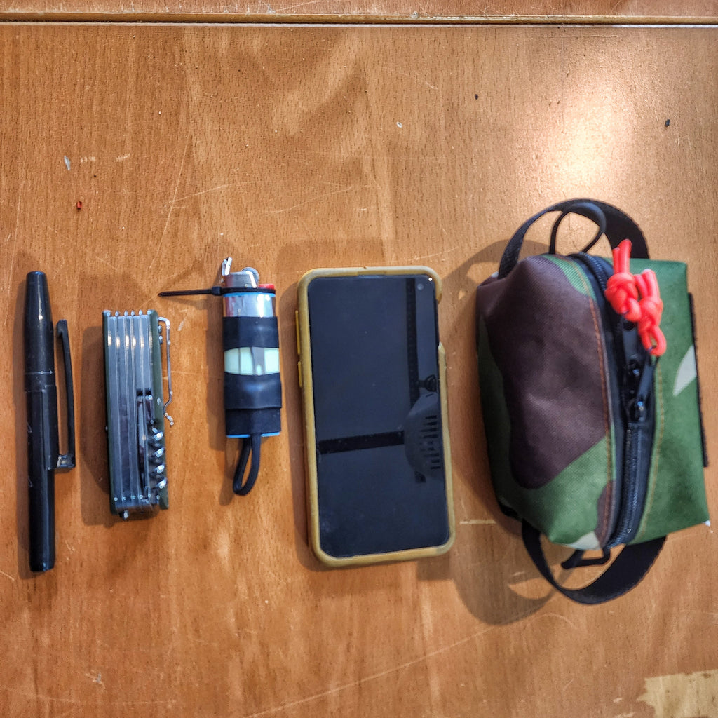 Survival Kit Lighter - Fire Starter outfitted with supplies.